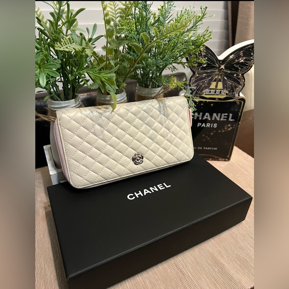 CHANEL Quilted Cream Leather Zip Wallet with Silver Camellia Accent